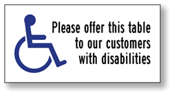 Click here to view larger image Package of 6 Transparent Labels for Restaurant Tables- with Wheelchair Symbol (ISA) and text reading: Please offer this table to our customers with disabilities- 4x2