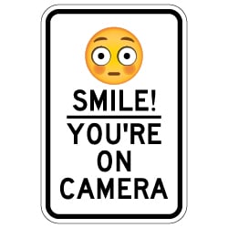Smile! You're On Camera Sign with Flushed Face Emoji - 12x18 - Made with Reflective Rust-Free Heavy Gauge Durable Aluminum available online for shipping from STOPSignsAndMore.com
